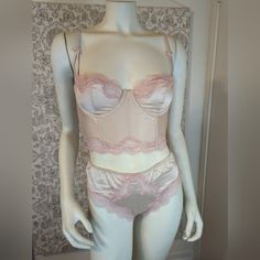 Victoria's Secret Bustier And Panty Set Pale Peach And Light Pink 34c & Medium Set Selling As Set - The Top Features Pale Peach Satin Fabric And Pale Pink Lace. Back Has Elastic And Cutout Details With Hook & Eye Closure. Top Is A 34c. Panty Is Matching Fabric In Light Peach With Pale Pink Lace Cutouts. Back Has Cheeky Moderate Coverage. Both Items Are New With Tags. Classic Vintage Pinup Style. Pink Fitted Bra-friendly Camisole, Fitted Pink Bra-friendly Camisole, Fitted Pink Victoria's Secret Camisole, Pink Coquette Underwire Bra, Pink Fitted Coquette Camisole, Pink Underwire Camisole With Built-in Bra, Fitted Pink Bra For Loungewear, Victoria's Secret Pink Lace Trim Camisole, Feminine Pink Bra With Lined Body