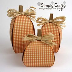 three pumpkin shaped boxes tied with twine