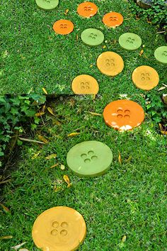 several orange and green discs on the ground with holes cut out to look like faces