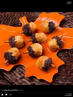 some food is sitting on an orange platter and has chocolate sprinkles