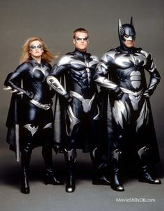 three people dressed as batman and catwoman standing next to each other with their hands on their hips