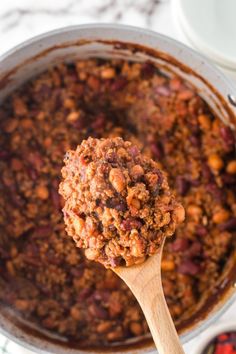 A wooden spoon holds a spoonful of southern homemade chili above a potful of chili. Chili Stovetop, Best Ground Beef Recipes, Easy Main Dishes, Crowd Pleasing Recipes, Chili Recipe Easy, Easy Party Food