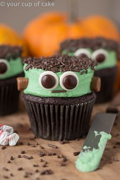 some cupcakes with green frosting and googly eyes