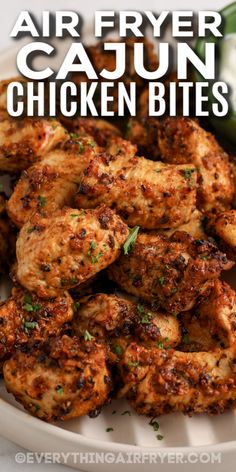 air fryer cajun chicken bites on a plate with cilantro and jalapenos