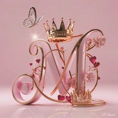 a pink and gold letter with a crown on top is surrounded by flowers and butterflies