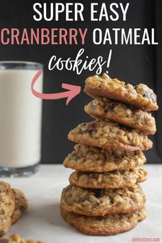 a stack of cookies next to a glass of milk with the words super easy cranberry oatmeal cookies