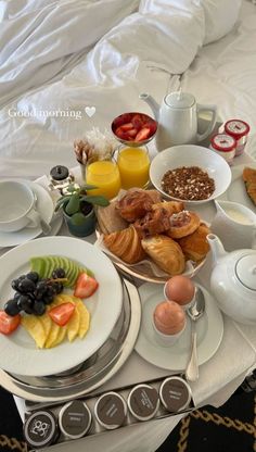 the breakfast is prepared and ready to be eaten on the bed in the hotel room