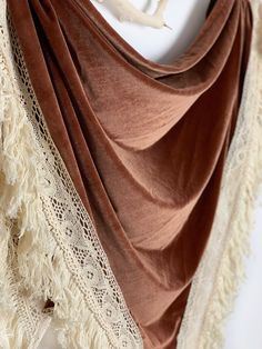 "We love the vibe of these boho inspired bridal wedding shawls. They are a super chic option for all brides! The unique, romantic design will add drama to your photos and make for a stunning accessory that all your guests will be talking about! A high-fashion handmade Arrow and Thread velvet shrug shawl is a gorgeous addition to your wedding look and we've got you covered! Literally! The handmade stretch velvet shawl wraps are made with high quality fabrics and trims. Each shawl has an open fron Bridal Velvet Shawl, Wedding Shawls And Wraps Fall, Bohemian Dupatta With Traditional Drape, Bohemian Shawl Dupatta With Fringe, Bohemian Wedding Scarves With Traditional Drape, Bohemian Shawl Scarves For Wedding, Bohemian Shawl Scarf For Wedding, Bohemian Shawl With Traditional Drape For Festivals, Bohemian Wedding Shawl Scarves