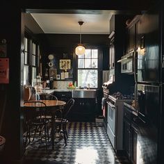 a kitchen with black and white checkered flooring