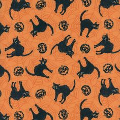 an orange background with black cats on it