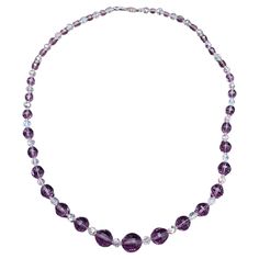 Embrace the allure of yesteryear with this vintage necklace, a stunning piece that captures the essence of classic elegance. This necklace features graduated faceted rock crystal beads in a rich amethyst hue, beautifully alternating with clear aurora borealis crystals that reflect a spectrum of colors. The sterling silver vintage clasp is not only functional but stylish. At 24.5 inches in length, it lays gracefully along the collarbone, making it a versatile addition to any wardrobe! Key Feature Aurora Borealis Crystal, Decorative Hooks, Vintage Rock, Hook Clasp, John Galliano, Rock Crystal, Donna Karan, Aurora Borealis, Classic Elegance