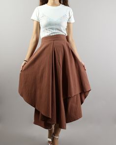 * A cropped pants, wide leg and fashion style. * Asymmetrical hem, and made of linen, two layers, outer layer is skirt, inner layer is pants. * With one pocket on the right side. * Materials: 50% cotton, 50% linen Shop sizing chart FYI ( actual body figures, not laying flat clothes measurements) Size XS (US 2, UK 6, German 32, French 34) Bust: fits bust around 33.5 inches/85cm Waist: fits waist around 26 inches/66cm Hips: fits hips around 36 inches/91cm Size S (US 6, UK 10, German 36, French 38) Hidden Pants Skirt, Brown Fitted Bottoms With Asymmetrical Hem, Relaxed Long Skirt With Layered Hem, Linen Bottoms With Asymmetrical Hem For Summer, Summer Linen Bottoms With Asymmetrical Hem, Spring Linen Bottoms With Asymmetrical Hem, Fitted Bottoms With Layered Asymmetrical Hem, Casual Cotton Bottoms With Handkerchief Hem, Flowy Pants Outfit