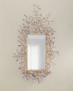 a mirror mounted to the side of a wall