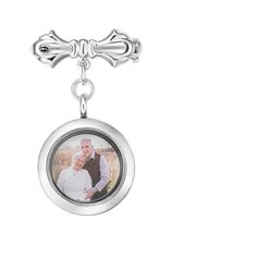 a key chain with an image of a man and woman hanging from the end of it