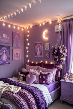 a bedroom decorated in purple and white with pictures on the wall, lights strung over the bed