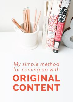 a white table topped with books and pencils next to a cup filled with pens