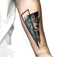 a man's arm with a tattoo on it and an image of a lion wearing a crown