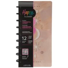 a spiral notebook with the words happy planner written on it and an image of a crescent