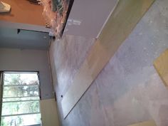 a room that is being remodeled with some paint on the walls and wall coverings