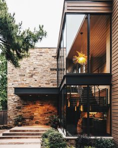 an outside view of a house with stairs leading up to it