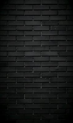 a black brick wall that is very dark