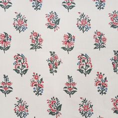 a white fabric with red and blue flowers on it