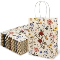 a bunch of paper bags with flowers on them