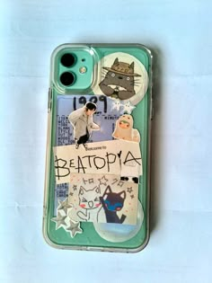 an iphone case with stickers and pictures on it