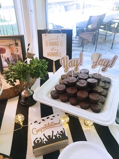 a table topped with lots of cupcakes on top of plates