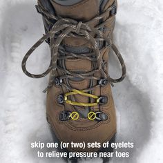 a pair of hiking boots in the snow with an advertise about how to use them