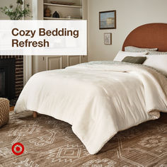 a cozy bedding refresh is featured in this image