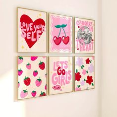 four pink and red wall art hanging on a white wall