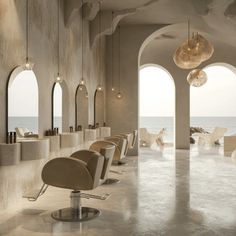 the interior of a modern hair salon overlooking the ocean