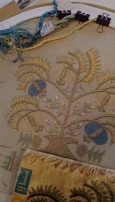 the embroidery is being worked on with scissors