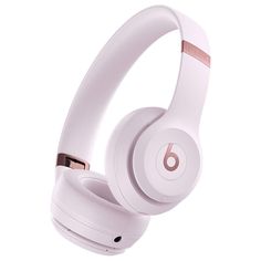 the beats on - ear headphones are white and have gold trim around their ears