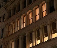 a building with many windows lit up at night