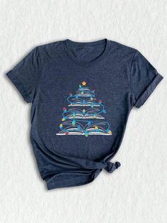 Get ready to celebrate the joy of the holiday season with our enchanting **holiday shirt**! This **cute Christmas tee** is designed for those who embrace the spirit of giving and cozy moments. Featuring a whimsical print that celebrates the magic of festive traditions, this **Christmas shirt** is perfect for your next **Christmas reunion** or as a standout piece in your **Christmas outfit** lineup. Are you a book lover? Our **books Christmas** design adds a unique twist that will resonate with any avid reader. This **book lovers shirt** is an ideal choice for the **bookworm Christmas** in your life, showcasing a playful homage to books and trees that leaves everyone smiling. Whether you're attending a cozy gathering, snuggling with a cup of cocoa, or gifting a special **gift for teachers** Pta Shirts, Quilt Shirt, Light Tree, Bookworm Shirt, Book Tree, Librarian Shirt, Christmas Gifts For Husband, Ribbon Shirt, Christmas Tree Shirt