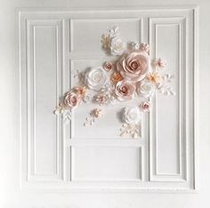 a white wall with flowers on it