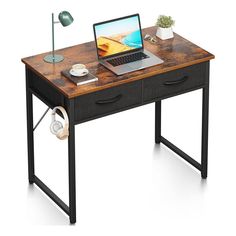 a laptop computer sitting on top of a wooden desk next to headphones and a lamp