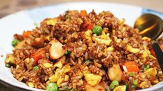 a white bowl filled with rice and vegetables