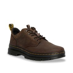 Dr. Martens-Reeder Utility Oxford - Men's Your everyday wear won't be the same when you lace-up the stylish Reeder utility oxford by Dr. Martens. Besides the heavy-duty leather construction, this lace-up comprises grooved edges, an AirWair heel loop and visible stitching that stays true to the Core Dr. Martens Dna. Lug sole is cemented to the upper for lasting and flexible strolls. Leather Footbed Lace-up Oxfords For Streetwear, Brown Lace-up Work Sneakers, Brown Lace-up Sneakers For Work, Steel Toe Leather Lace-up Sneakers, Leather Lace-up Steel Toe Sneakers, Leather Lace-up Sneakers With Steel Toe, Casual Brown Steel Toe Sneakers, Masculine Lace-up Shoes For Workwear, Masculine Lace-up Shoes For Work