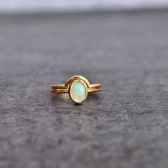 ✦ This exquisite opal ring set is the epitome of beauty. Our natural opal is sourced from welo mines of Ethiopia, creating a stunning shimmer that catches the eye of every onlooker. The handmade design adds to its special qualities, making it a unique treasure for anyone lucky enough to wear it.  Its versatile stackable design makes the perfect addition to any ensemble; simply add this ring to any existing jewelry or wear it alone as your very own birthstone! Each piece is crafted with extreme c Minimalist Gold Opal Rings, Gold Opal Birthstone Ring Minimalist Style, Minimalist 14k Gold Stackable Opal Ring, Minimalist Gold Opal Birthstone Ring, Minimalist Opal Stackable Promise Rings, Minimalist Opal Rings With Birthstone, Minimalist Opal Ring With Birthstone, Minimalist Stackable Opal Ring, Minimalist Opal Birthstone Ring