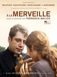 a man and woman standing next to each other in front of a poster for the movie la merveille