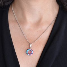 view size guide Small Swirl Pendant in Trans Pride colors. 💙 adjustable chain length up to 2" longer than the length you select from the drop-down menu💗 lightweight pendant is approximately 1" long (including bail) and 0.5" wide🤍 aluminum links with stainless steel chain, pendant bail and lobster claw clasp LGBTQ TRANSGENDER PRIDE - aqua, pink, white Trans Necklace, Pendant Bail, Pride Colors, Trans Pride, Pendant Bails, Chain Pendant, Steel Chain, Stainless Steel Chain, Lobster Claw