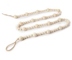 a white beaded necklace with wooden beads