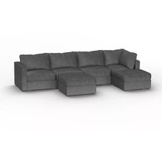 a large gray couch sitting on top of a white floor