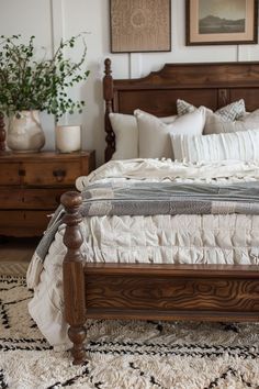 a large bed sitting in a bedroom on top of a rug