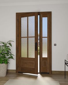 an empty room with two wooden doors and a potted plant on the far side