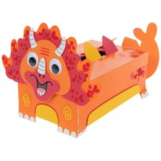 an orange and yellow toy with horns on it's head