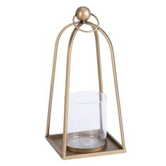 a candle holder with a glass in it and a metal stand on the side that holds a